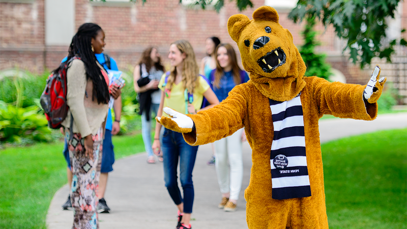 Nittany lion mascot welcoming students to campus.